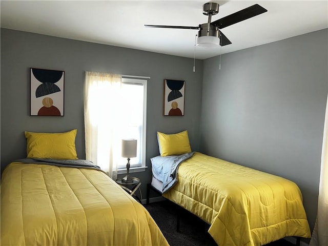 carpeted bedroom with ceiling fan