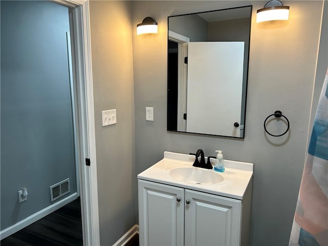 bathroom featuring vanity and hardwood / wood-style flooring