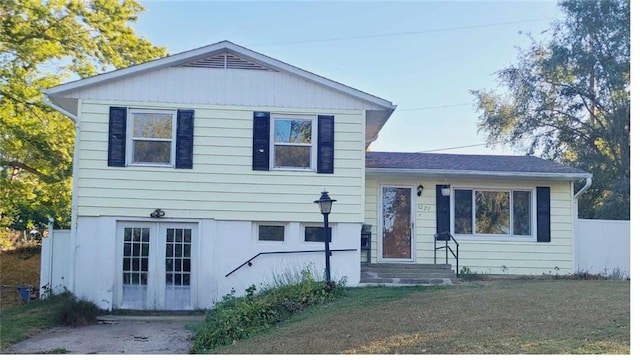 tri-level home with a front lawn