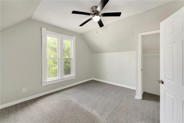 additional living space with carpet floors, lofted ceiling, and ceiling fan