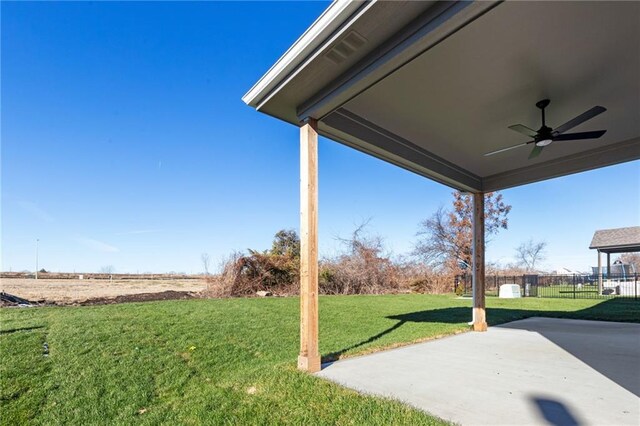 view of yard featuring ceiling fan and a patio area