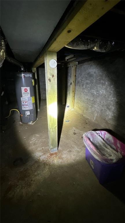 utility room featuring gas water heater