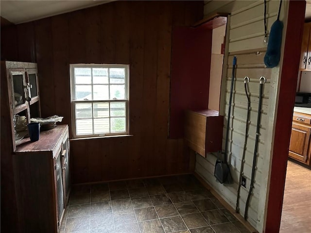 kitchen featuring wooden walls