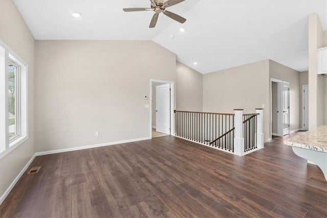 unfurnished room featuring lofted ceiling, baseboards, ceiling fan, dark wood-style floors, and recessed lighting