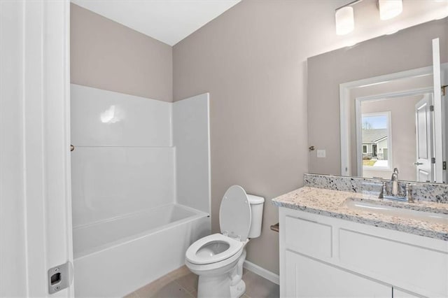 bathroom featuring bathtub / shower combination, vanity, baseboards, tile patterned floors, and toilet