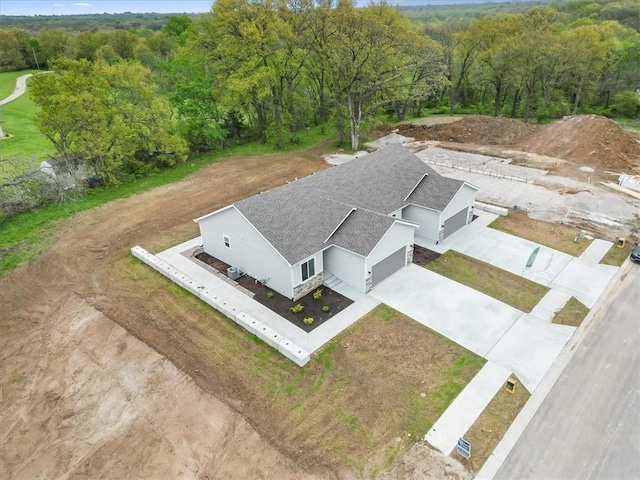 drone / aerial view with a view of trees