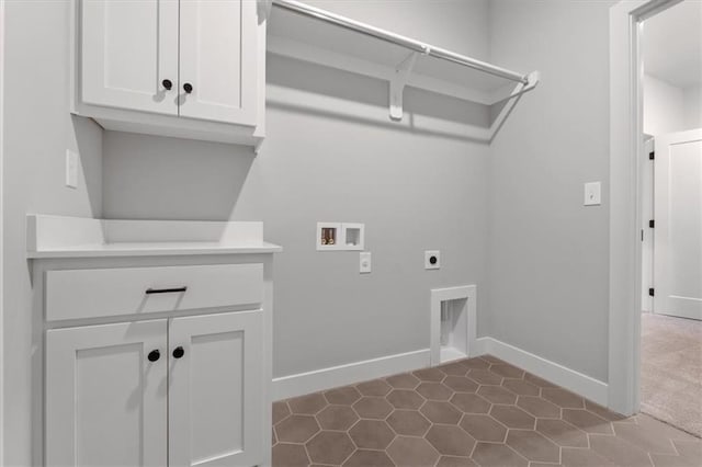 clothes washing area featuring washer hookup, hookup for an electric dryer, and cabinets