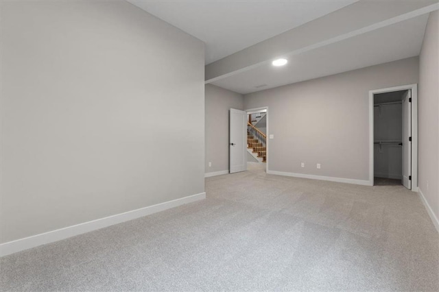 25026 W 94th Ter, Lenexa, KS 66227 - spare room featuring light carpet, stairway, baseboards, and recessed lighting