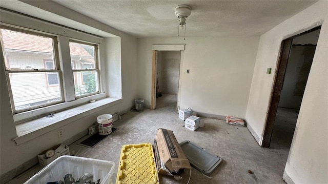 interior space featuring a textured ceiling