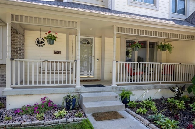 property entrance with covered porch