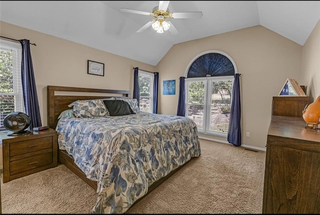 carpeted bedroom with ceiling fan and lofted ceiling