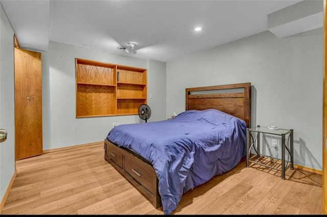 bedroom with light wood-type flooring