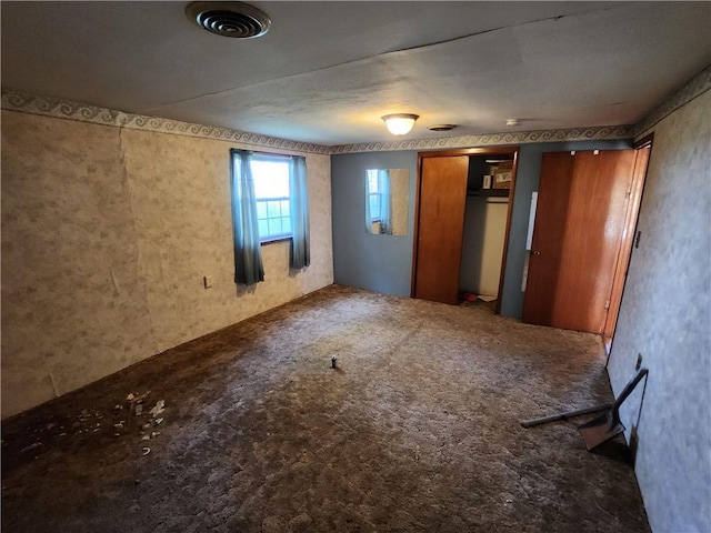 unfurnished bedroom with carpet