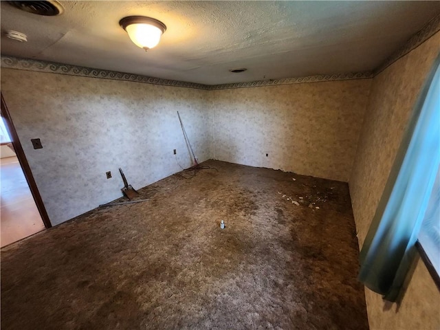 interior space featuring a textured ceiling