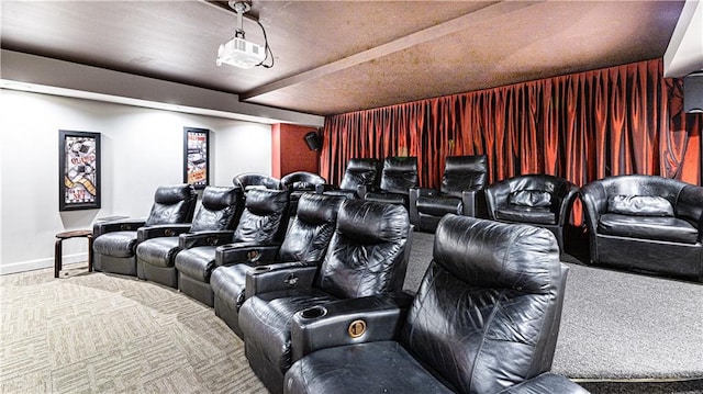 home theater featuring baseboards and carpet flooring