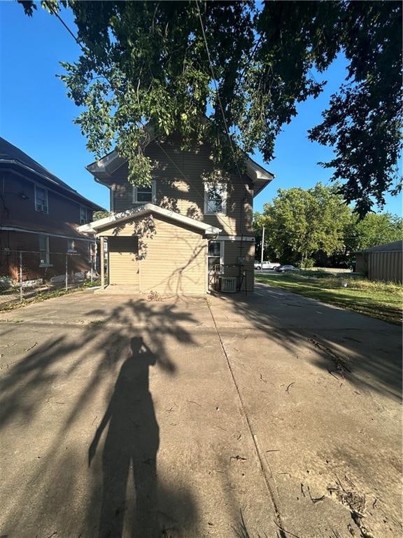 view of side of property featuring a garage