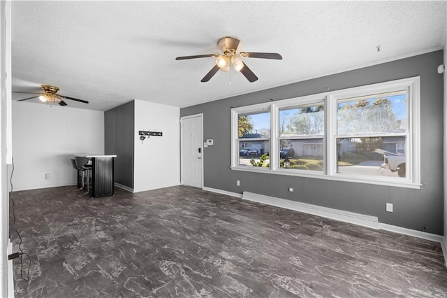 unfurnished living room with a textured ceiling and ceiling fan