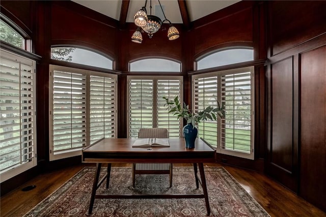 home office featuring vaulted ceiling with beams, a chandelier, plenty of natural light, and dark hardwood / wood-style flooring