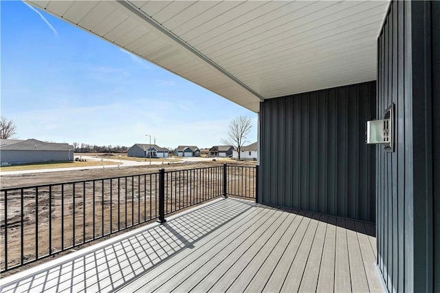 wooden deck with a residential view