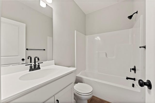 full bathroom featuring  shower combination, vanity, and toilet