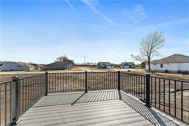 wooden deck with a residential view