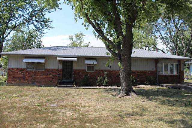 ranch-style house with a front lawn