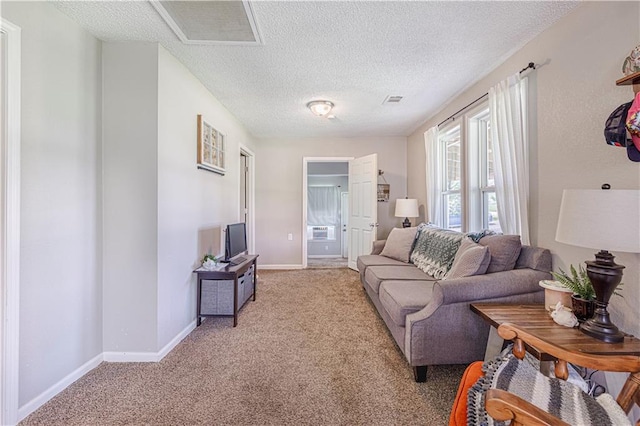 carpeted living room featuring a textured ceiling