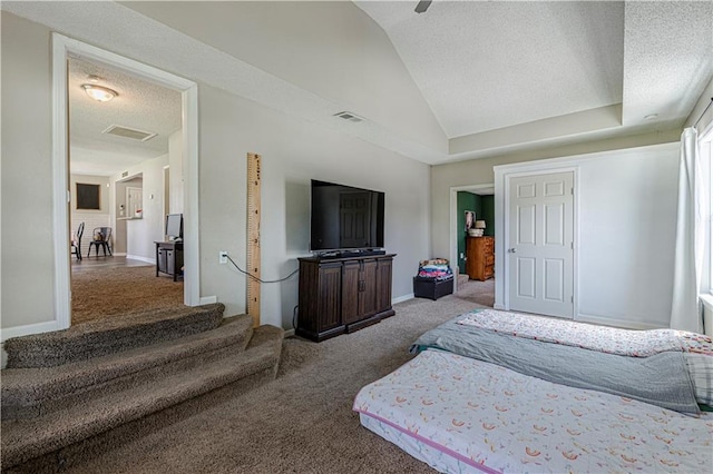 carpeted bedroom with a textured ceiling, lofted ceiling, and ceiling fan