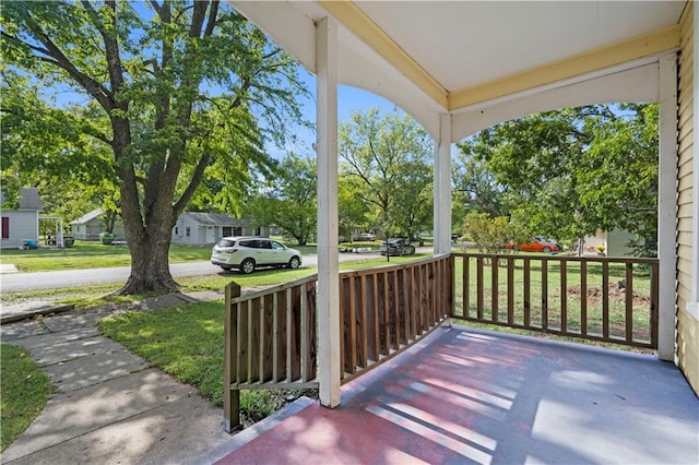 exterior space featuring a yard and covered porch