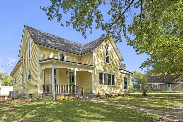 view of front of property with a front lawn, central air condition unit, and a porch