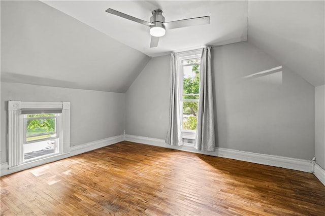 bonus room featuring ceiling fan, hardwood / wood-style flooring, and lofted ceiling