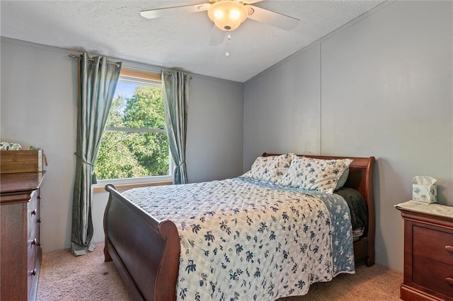 carpeted bedroom with ceiling fan, lofted ceiling, and a textured ceiling