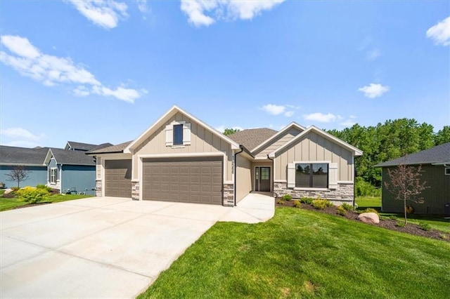14566 Aurora Ln, Basehor, KS 66007 - craftsman house featuring a garage, stone siding, board and batten siding, a front lawn, and concrete driveway