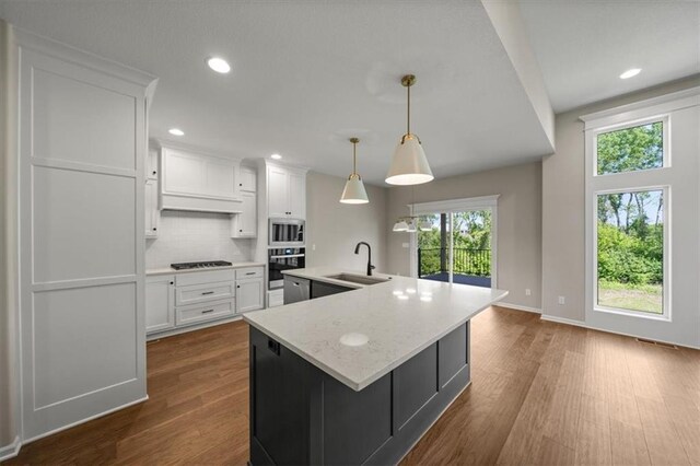 14566 Aurora Ln, Basehor, KS 66007 - kitchen featuring stainless steel appliances, a sink, dark wood-style flooring, white cabinets, and recessed lighting
