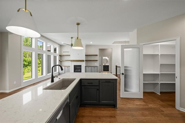 14566 Aurora Ln, Basehor, KS 66007 - kitchen with a sink, open floor plan, decorative light fixtures, dark wood finished floors, and dishwasher