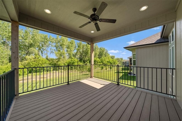 14566 Aurora Ln, Basehor, KS 66007 - wooden terrace with ceiling fan, a yard, and view of scattered trees
