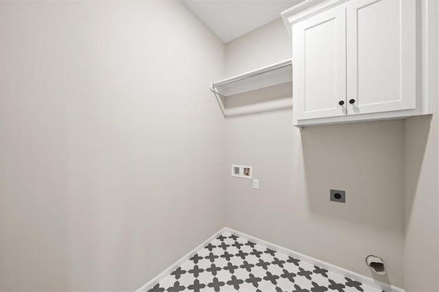 14566 Aurora Ln, Basehor, KS 66007 - clothes washing area featuring electric dryer hookup, baseboards, hookup for a washing machine, cabinet space, and tile patterned floors