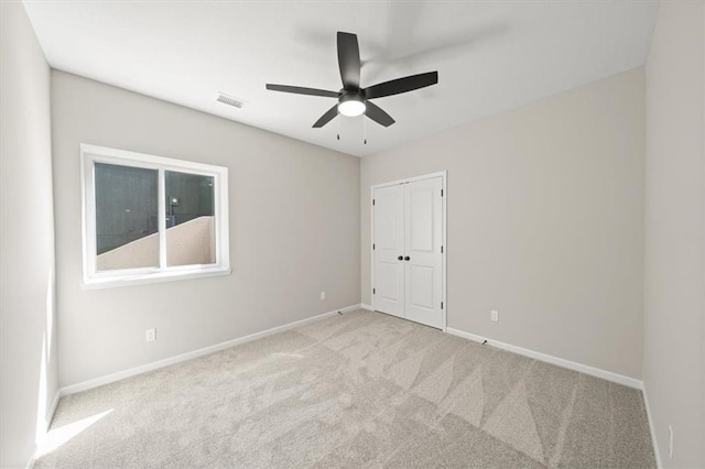 14566 Aurora Ln, Basehor, KS 66007 - unfurnished bedroom featuring carpet flooring, baseboards, a closet, and ceiling fan