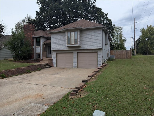 view of front facade with a front yard and a garage