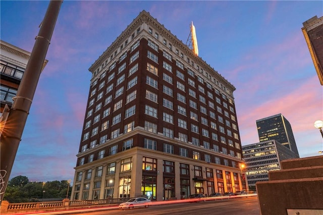 view of outdoor building at dusk