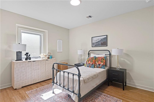 25134 W 98th Pl, Lenexa, KS 66227 - bedroom featuring baseboards and light wood-type flooring