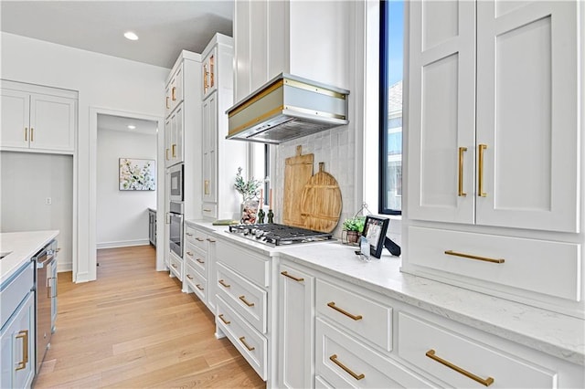 25110 W 98th Pl, Lenexa, KS 66227 - kitchen featuring white cabinetry, light wood-type flooring, appliances with stainless steel finishes, light stone counters, and recessed lighting