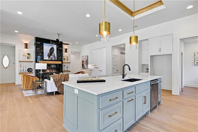 25110 W 98th Pl, Lenexa, KS 66227 - kitchen with light wood finished floors, hanging light fixtures, dishwasher, recessed lighting, and white cabinetry