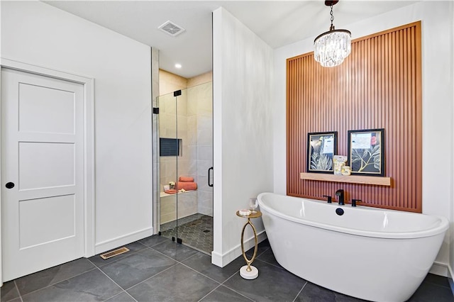 25110 W 98th Pl, Lenexa, KS 66227 - bathroom featuring a freestanding tub, a shower stall, tile patterned floors, and a chandelier