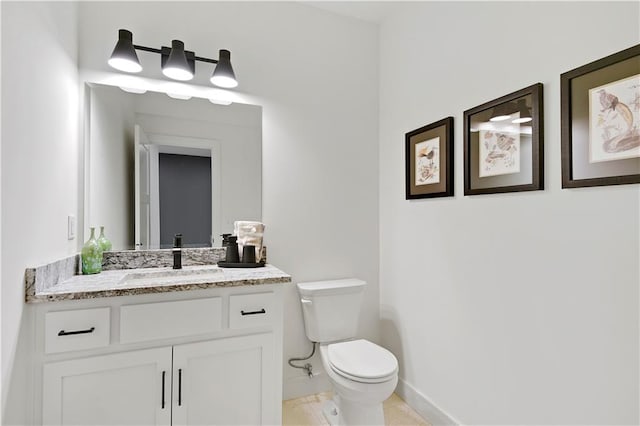 bathroom featuring vanity, toilet, and tile patterned floors