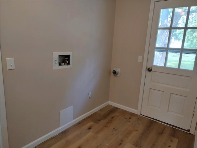 washroom with laundry area, light wood-type flooring, baseboards, electric dryer hookup, and washer hookup