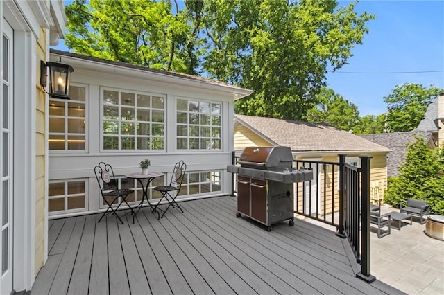 wooden terrace featuring grilling area