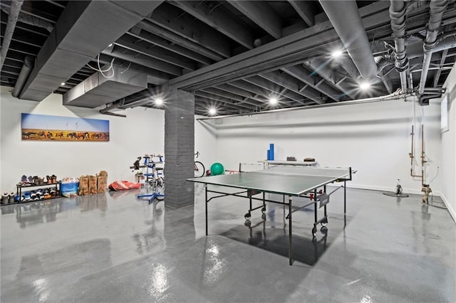 game room with concrete floors