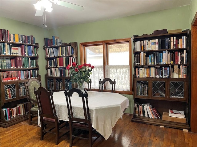 dining area featuring ceiling fan and wood finished floors