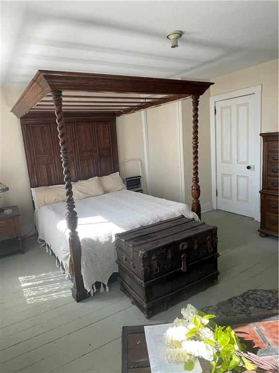 bedroom with wood finished floors